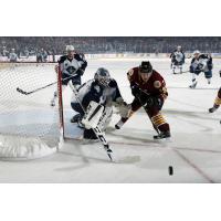 Chicago Wolves F Evan Trupp Eyes a Loose Puck vs. the Milwaukee Admirals