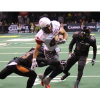 Arizona Rattlers make a tackle against the Sioux Falls Storm