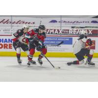 Kelowna Rockets centre Scott Cousins handles the puck against the Prince George Cougars