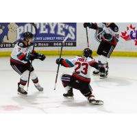 Jake Poole of the Kelowna Rockets celebrates with teammates following a goal