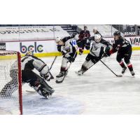 Vancouver Giants defenceman Connor Horning (center) vs. the Prince George Cougars