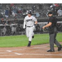 Luke Voit reaches home after a homer in the rain