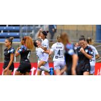 Yuki Nagasato of Racing Louisville FC is lifted into the air following her goal against the Chicago Red Stars