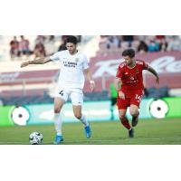 Phoenix Rising FC midfielder Aodhan Quinn (right) vs. Sacramento Republic