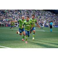 Seattle Sounders FC celebrate a goal against the Vancouver Whitecaps