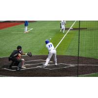 Dayson Croes of the Green Bay Booyah pokes a ball toward third