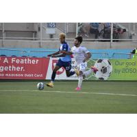 Forward Madison FC forward Derek Gebhard (left) vs. New England Revolution II