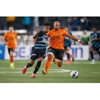 Colorado Springs Switchbacks FC forward Austin Dewing (left) vs. Orange County SC