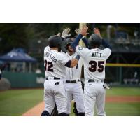 The Tacoma Rainiers celebrate at home following a home run