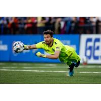 Colorado Springs Switchbacks FC goalkeeper Sean Melvin dives for a ball vs. Real Monarchs