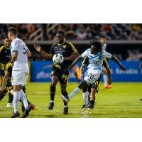 Colorado Springs Switchbacks FC midfielder Phillip Mayaka (right) vs. New Mexico United