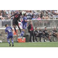 Phoenix Rising FC midfielder James Musa (41) goes high against the Charlotte Independence