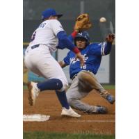 New York Boulders' Tucker Nathans prepares to tag out Equipe Quebec's Ruben Castro