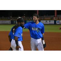 Devin Hairston and Galli Cribbs Jr. (right) of the Pensacola Blue Wahoos after Cribbs' game-winning hit