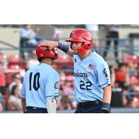 Spokane Indians infielder Aaron Schunk (right)