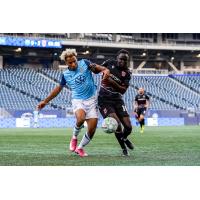 HFX Wanderers fullback Morey Doner (left) battles for possession