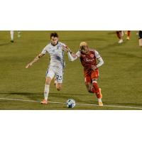 South Georgia Tormenta FC defender Curtis Thorn (left) vs. the Richmond Kickers