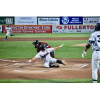 Aaron Palensky of the Somerset Patriots slides home