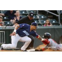 New Jersey Jackals' Demetrius Moorer slides safely into third base on a steal attempt ahead of tag by the New York Boulders' Ray Hernandez