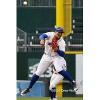 New York Boulders' 3B Ray Hernandez makes off balance throw to nail Equipe Quebec's L.P. Pelletier at first base