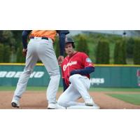 Jarred Kelenic of the Tacoma Rainiers slides safely into third