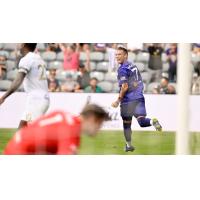 Louisville City FC forward Cameron Lancaster reacts after a goal against FC Tulsa
