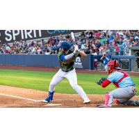 Tulsa Drillers at the plate in their camo jerseys