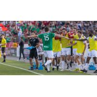 Jalen Crisler of the Richmond Kickers is greeted by teammates