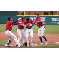 Tacoma Rainiers mob Erick Mejia after their walk-off win