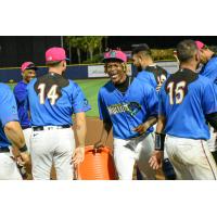 Pensacola Blue Wahoos and Norel González react after a walk-off win