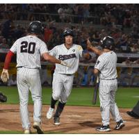 Anthony Volpe of the Somerset Patriots is greated at home plate