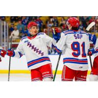 Kitchener Rangers exchange high fives following a goal against the Guelph Storm