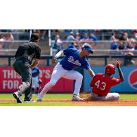 Leonel Valera of the Tulsa Drillers tags out former Tulsa Driller Errol Robinson