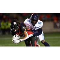 Toronto Argonauts defensive back DaShaun Amos makes a tackle against the Ottawa RedBlacks