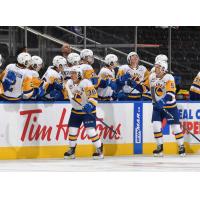 Saskatoon Blades' Aidan De La Gorgendiere  and Trevor Wong congratulate team