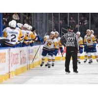 Trevor Wong of the Saskatoon Blades congratulating teammates