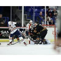 Vancouver Giants' Damian Palmeri and Jesper Vikman battle Kamloops Blazers' Daylan Kuefler