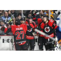 Cincinnati Cyclones' Patrick Polino and Luc Brown celebrate win with team