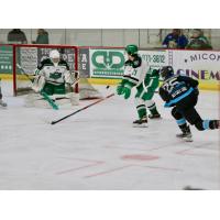 Luke Levandowski of the Wisconsin Windigo (right) fires a shot against the Chippewa Steel