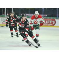 Belleville Senators' Jarid Lukosevicius and Cole Reinhardt with Utica Comets' Tyce Thompson on the ice