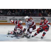 Peterborough Petes' Tommy Purdeller battles Ottawa 67s' Collin MacKenzie and Brad Gardiner