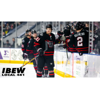 Indy Fuel exchange high fives along the bench