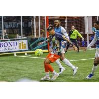 Florida Tropics' Ben-Avir Espinal and St. Louis Ambush's Anthony Brown on the field