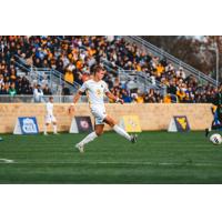 Defender Max Broughton with West Virginia University